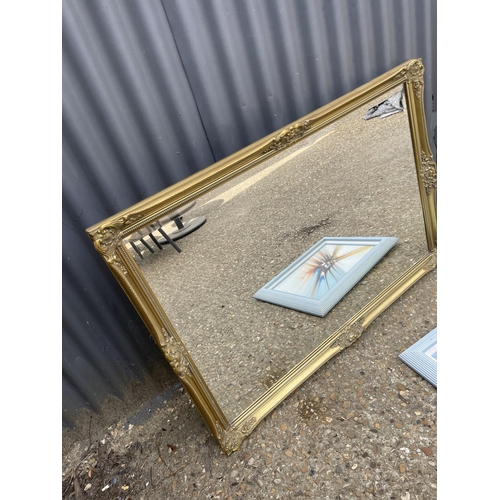 31 - A good quality modern gilt framed mirror 70x120 together with another gilt mirror and a modern oil p... 