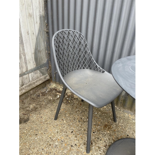 33 - A modern patio table and two chairs by KETTLER