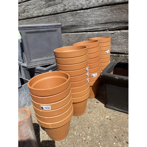 367 - A collection of 33 new Italian terracotta garden pots 9inch diameter