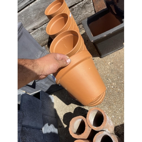 367 - A collection of 33 new Italian terracotta garden pots 9inch diameter