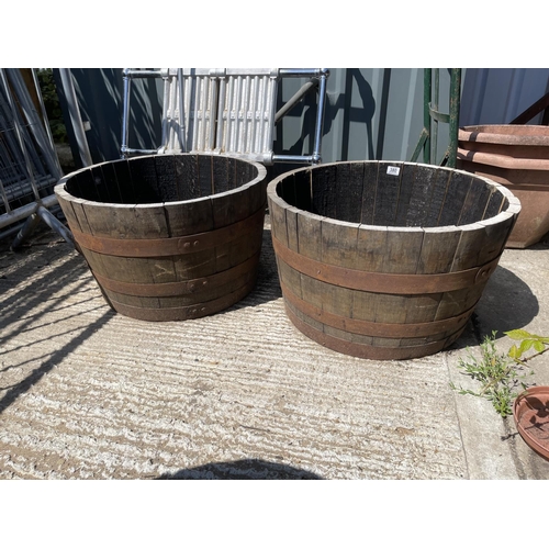 380 - A pair of Scottish oak half whiskey barrel planters 2ft round