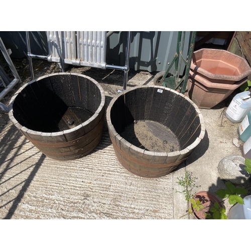 380 - A pair of Scottish oak half whiskey barrel planters 2ft round