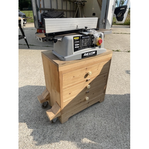 399 - A rexon power planer on three drawer stand