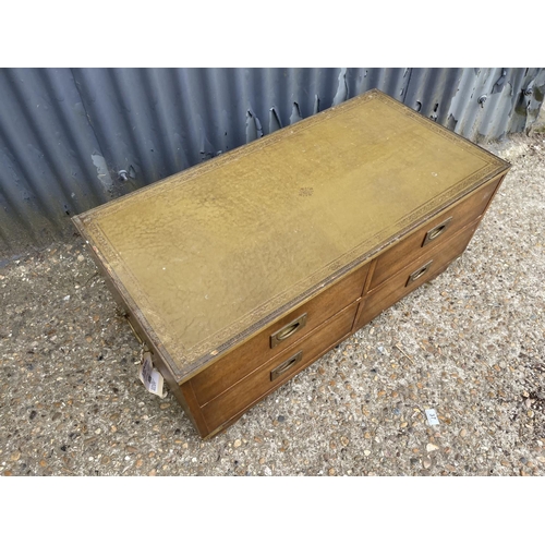 42 - A repro military style four drawer coffee table with green leather top 96x 42x 30