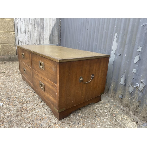 42 - A repro military style four drawer coffee table with green leather top 96x 42x 30