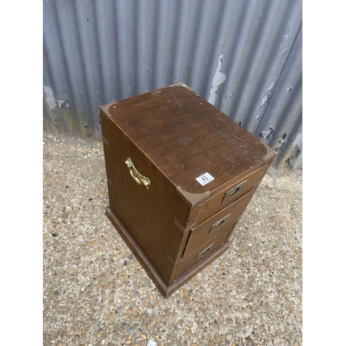 43 - A campaign style three drawer bedside 30x40x60