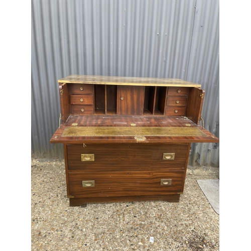 44 - A military style secretaire chest of five drawers with green leather top