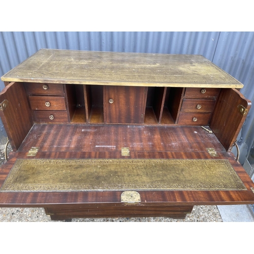 44 - A military style secretaire chest of five drawers with green leather top