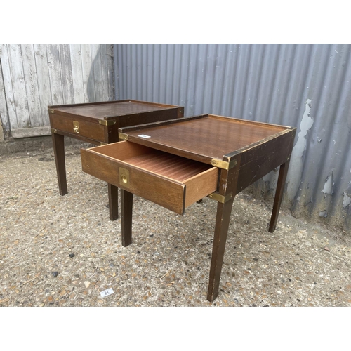 45 - A pair of military style mahogany lamp tables with brass handles