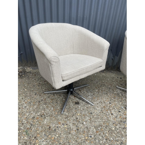 50 - A pair of retro design tub shape chairs with chrome star form base