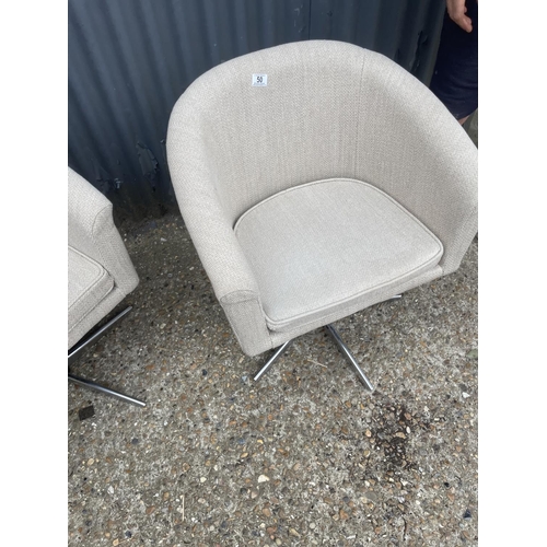 50 - A pair of retro design tub shape chairs with chrome star form base