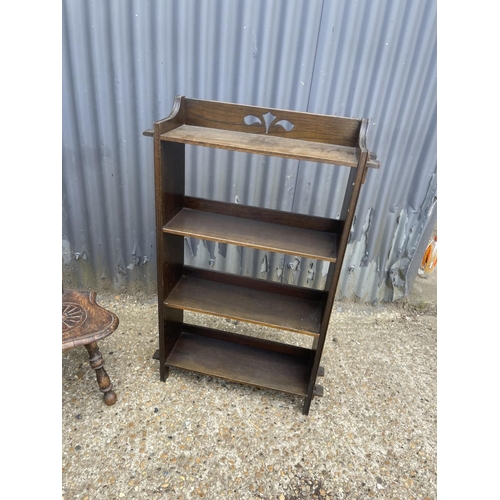 55 - AN OAK BOOKCASE, NEST OF THREE, BOOK TABLE AND CARVED SPINNING CHAIR