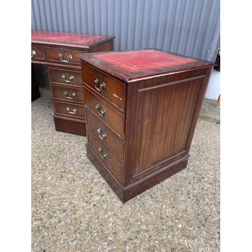 56 - A reproduction mahogany twin pedestal desk together with matching filing cabinet and nest of three