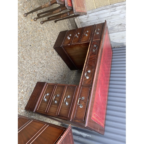 56 - A reproduction mahogany twin pedestal desk together with matching filing cabinet and nest of three