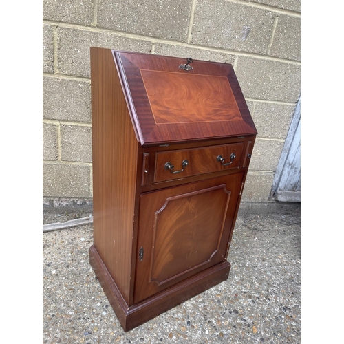 57 - A reproduction mahogany bureau