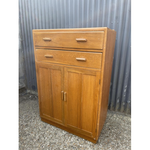 6 - A mid 20th century light oak tallboy gents wardrobe 84x46x 123