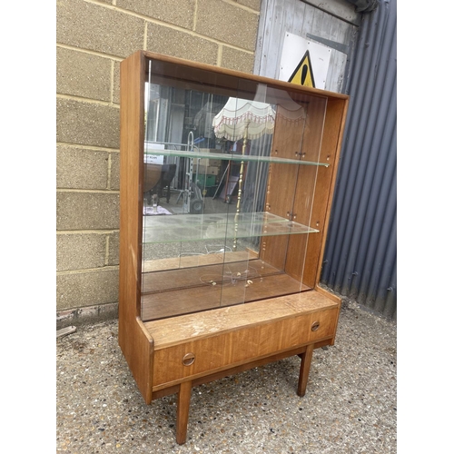 62 - A mid century teak display cabinet with drawer