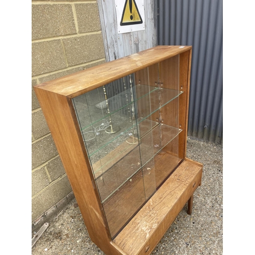 62 - A mid century teak display cabinet with drawer