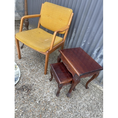 63 - A retro chair, nest of two, frameless mirror, and plant stand