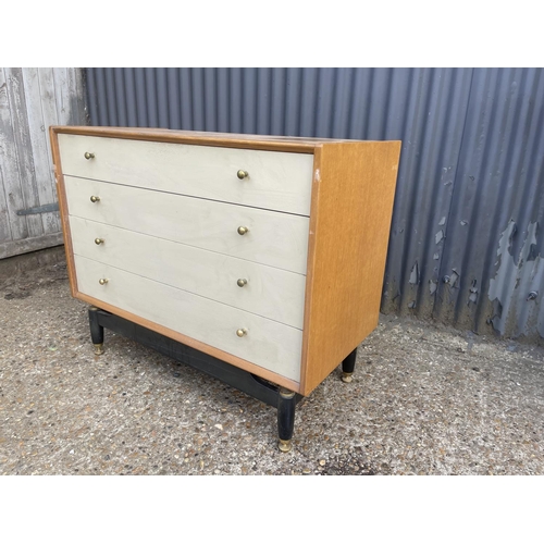 65 - A g plan light oak chest of four drawers