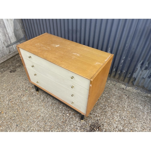 65 - A g plan light oak chest of four drawers