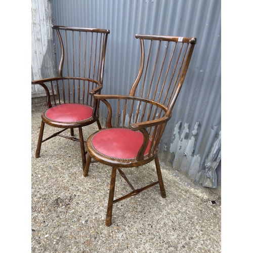 73 - A pair of arts and crafts stick back carver chairs