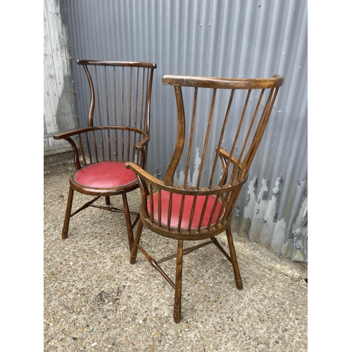 73 - A pair of arts and crafts stick back carver chairs