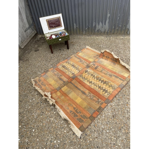 78 - Two rugs, and sewimg box with contents