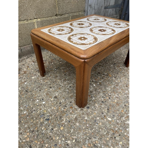 82 - A teak chest of three drawers, teak nest of three and a g plan coffee table