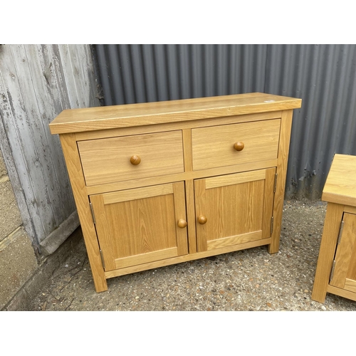 84 - A modern light oak two drawer sideboard together with a tv stand