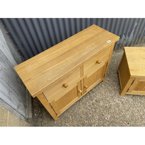 84 - A modern light oak two drawer sideboard together with a tv stand