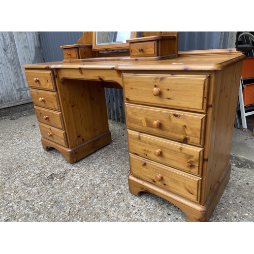 86 - A ducal pine dressing table with swing mirror