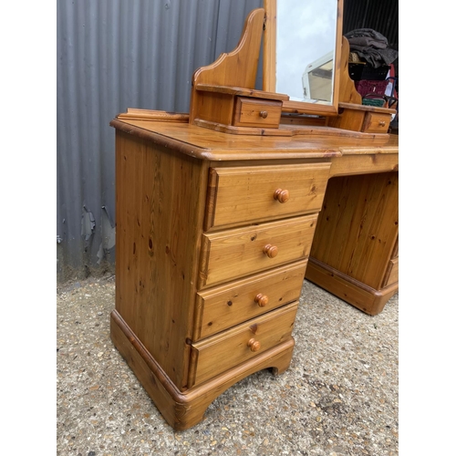 86 - A ducal pine dressing table with swing mirror