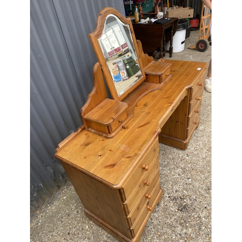 86 - A ducal pine dressing table with swing mirror