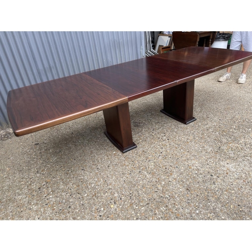 93 - A large extending danish rosewood dining table possibly by koefod with 2 extension leaves and glass ... 