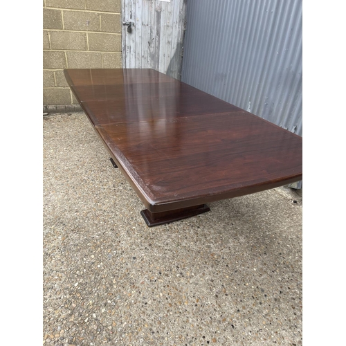 93 - A large extending danish rosewood dining table possibly by koefod with 2 extension leaves and glass ... 