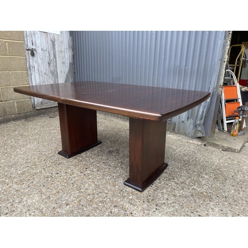 93 - A large extending danish rosewood dining table possibly by koefod with 2 extension leaves and glass ... 