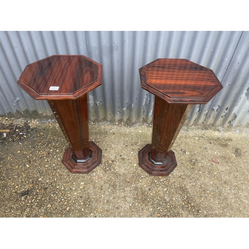 360B - A pair of Art Deco walnut effect  trumpet shaped occasional tables