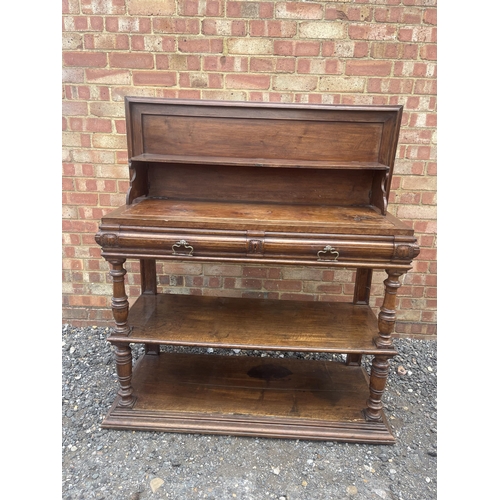 10 - An antique continental walnut two drawer buffet with folding top 115x43x90