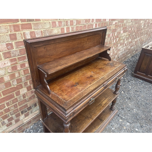 10 - An antique continental walnut two drawer buffet with folding top 115x43x90