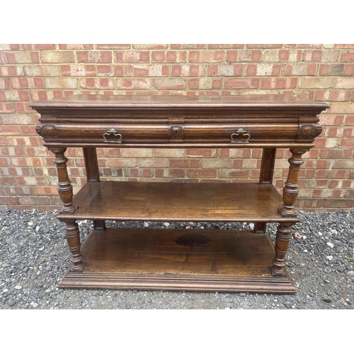 10 - An antique continental walnut two drawer buffet with folding top 115x43x90