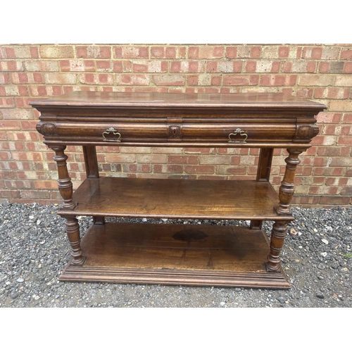 10 - An antique continental walnut two drawer buffet with folding top 115x43x90