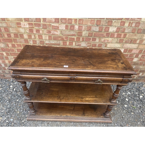 10 - An antique continental walnut two drawer buffet with folding top 115x43x90