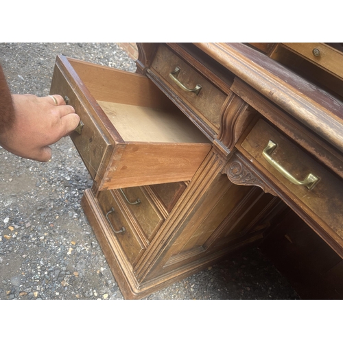 11 - A large good quality American walnut patent roll top desk with fitted interior and 9 locking drawers... 