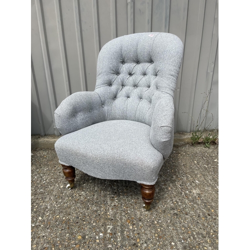 120 - A Victorian button back nursing chair, recently upholstered in grey