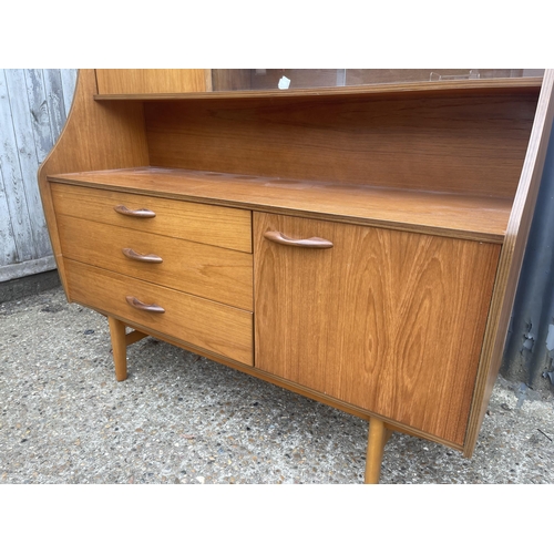 131 - A teak cocktail sideboard by AVALON 135x46x137