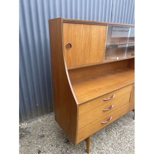 131 - A teak cocktail sideboard by AVALON 135x46x137