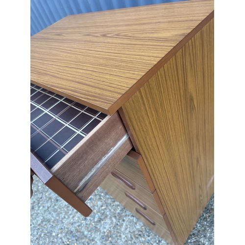 134 - A mid century teak effect chest of drawers 75x44x93