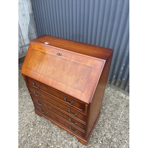 136 - A reproduction yew bureau