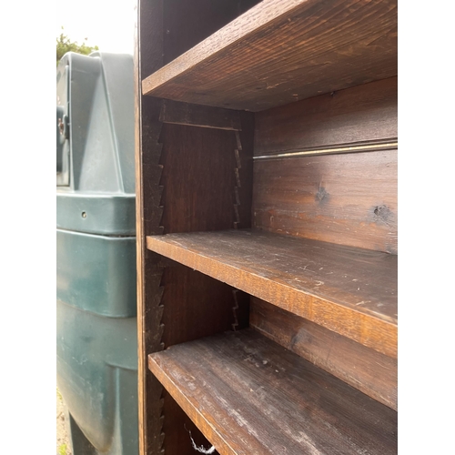 144 - A early 20th century oak open fronted bookcase with adjustable shelves and carved top 122x27x177